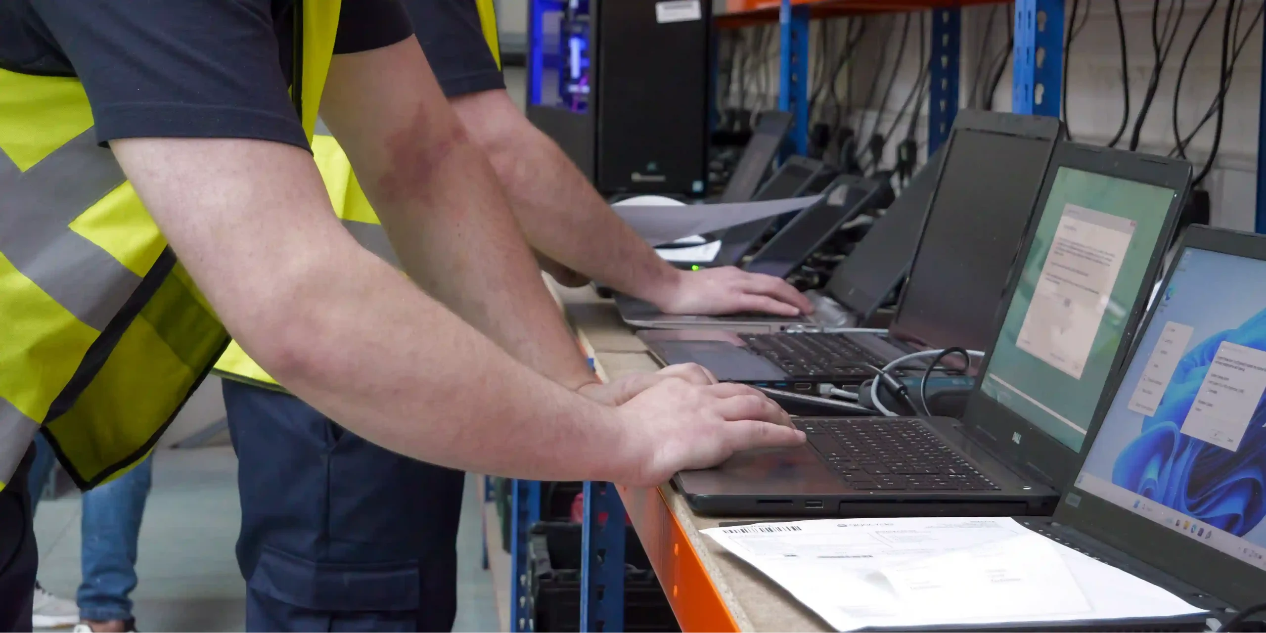 Refurbished business laptops lined up after hardware grading and functional testing